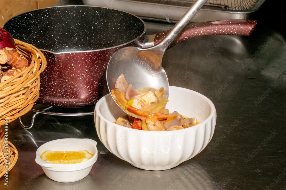 Fototapeta premium A ladle pours hearty, steaming stew into a porcelain bowl, evoking cozy autumn equinox gatherings and Hygge culinary traditions