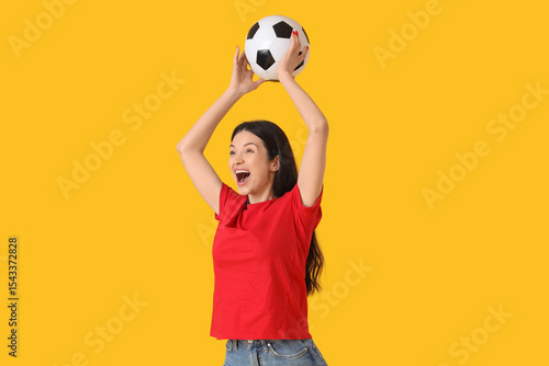 Happy young woman with socc...