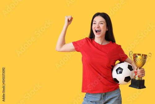 Happy young woman with socc...