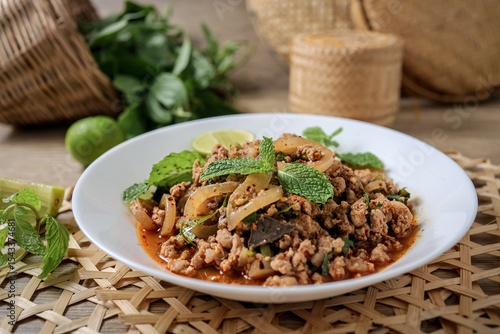 Fotografie Spicy Minced Pork Salad, thai isan food, thai called Larb Moo