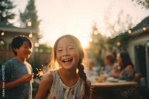 Smiling family enjoying golden hour backyard barbecue, relaxed summer gathering