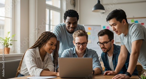 Focused Business Team Around Laptop in Meeting
