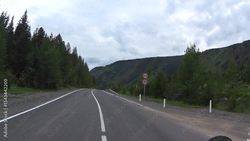 riding a motorcycle on the mountain road riding a motorcycle on the mountain road