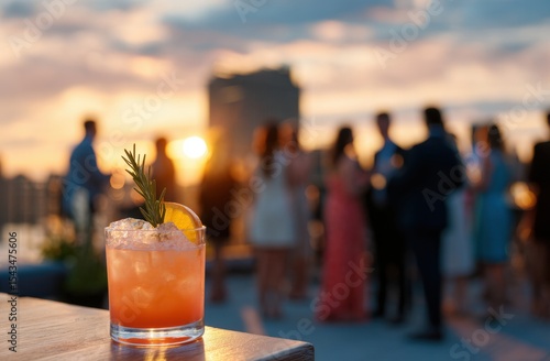 Wallpaper Mural Cocktail orange slice rosemary garnish on wood bar blurred figures cityscape at sunset Torontodigital.ca