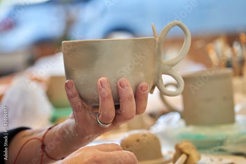 Shape clay with hands