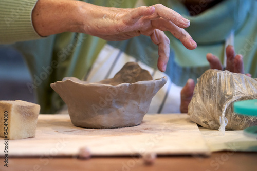 Shape clay with hands