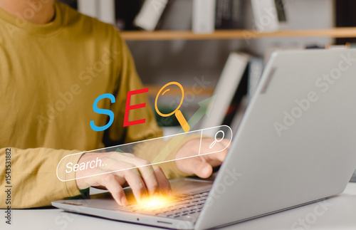Papier peint SEO optimization with a laptop, utilizing a search engine interface and digital tools for boosting website traffic and improving online visibility in a modern workspace