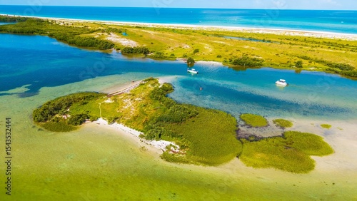 Drone view of Caladesi Island with small spoil island in the foreground