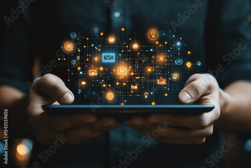 Close up of man holding a tablet displaying business