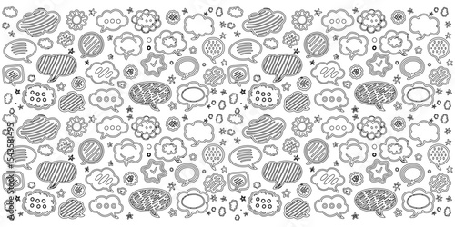 Hand-drawn black and white chalk doodles of speech bubbles on dusty slate background