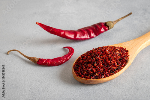 Red chili peppers.Red chili peppers in a wooden bowl on a bright background.Dried chili peppers