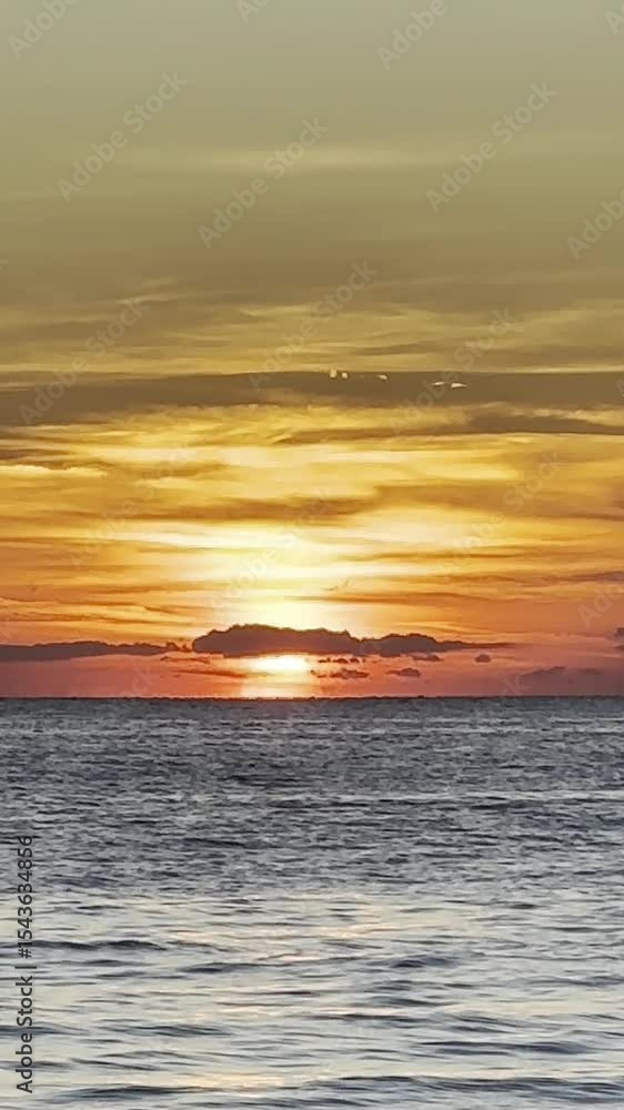 A Stunning and Colorful Sunset Over the Tranquil Ocean with Captivating Scenic Views A Stunning and Colorful Sunset Over the Tranquil Ocean with Captivating Scenic Views