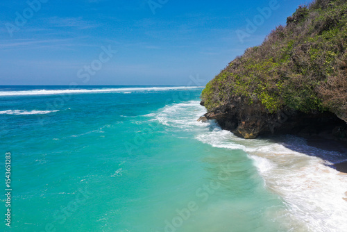 Wallpaper Mural Coastal Cave Beneath Forested Cliff by Turquoise Ocean — Aerial View Torontodigital.ca