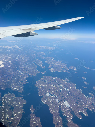 View from a plane passing over the frozen landscape of northern Canada and the Labrador Sea.