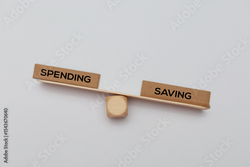 Billede på lærred Balance between savings and spending the concept of saving is heavier or more ne