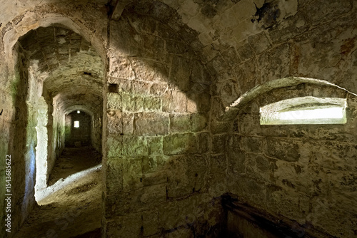 Fort Brusafer, Austro-Hungarian historical site of the Great War: interior of the caponier with the embrasures for machine guns. Trentino, Italy.