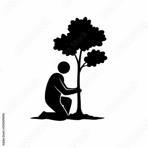 A silhouette of a person kneeling and hugging a young tree in a sign of environmental protection act