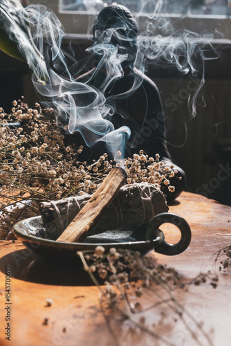 Burning Sage And Palo Santo With Rising Smoke