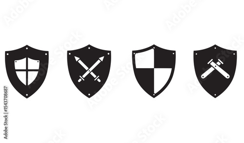 Set of four black shields displaying different medieval weaponry and symbols