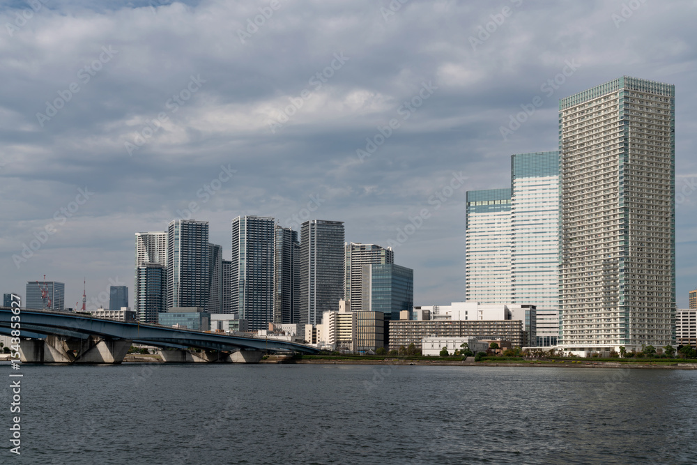 Harumiohashi Bridge and district of Chuo Harumi on reclaimed land, created by dropping earth and sediment generated from expanding Tokyo Bay, Tokyo, Japan Harumiohashi Bridge and district of Chuo Harumi on reclaimed land, created by dropping earth and sediment generated from expanding Tokyo Bay, Tokyo, Japan