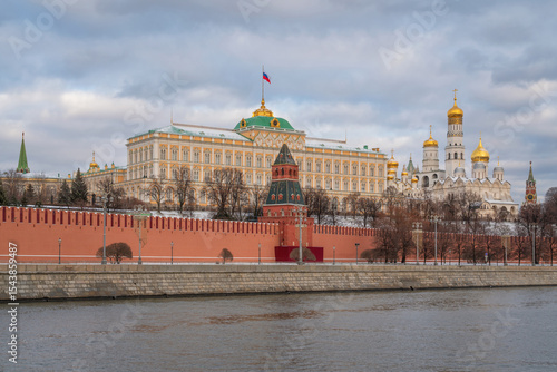 View of the building of the Grand Kremlin Palace, the Annunciation Tower and the ensemble of the Kremlin Cathedral Square from the embankment of the Moskva River, Moscow, Russia