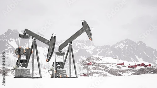 Oil Rigs Operate in Snowy Landscape With Mountains and Cabins in View
