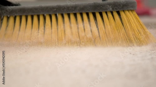 Dusty area swept up by broom slow motion