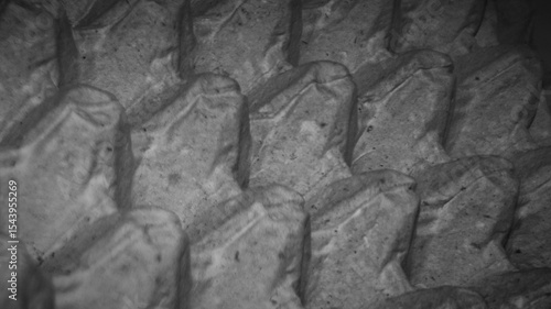 Close-up of a damaged grey cardboard egg tray showing intricate texture and physical imperfections. Ideal for industrial waste themes, texture overlays, and conceptual decay designs