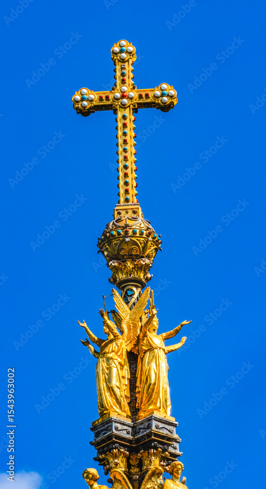 Fototapeta premium Golden Cross Angels Colorful, Albert Memorial, Kensington, London, England. Opened in 1872 after Prince Albert died at 42 years of age, Queen Victoria's husband.