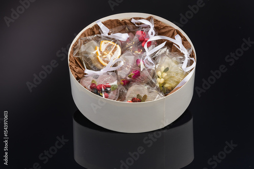 fruit berry tea in transparent balls and heart.