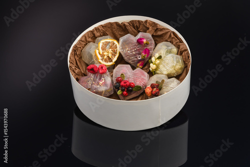 fruit berry tea in transparent balls and heart.