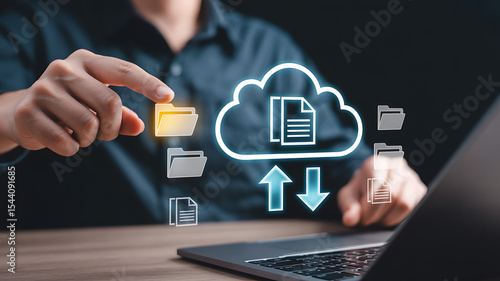 Person using laptop interacting with digital cloud data transfer icons