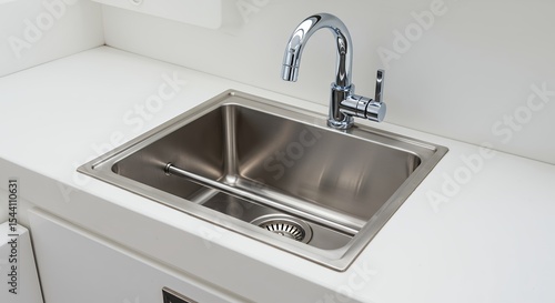 Stainless steel kitchen sink with chrome faucet