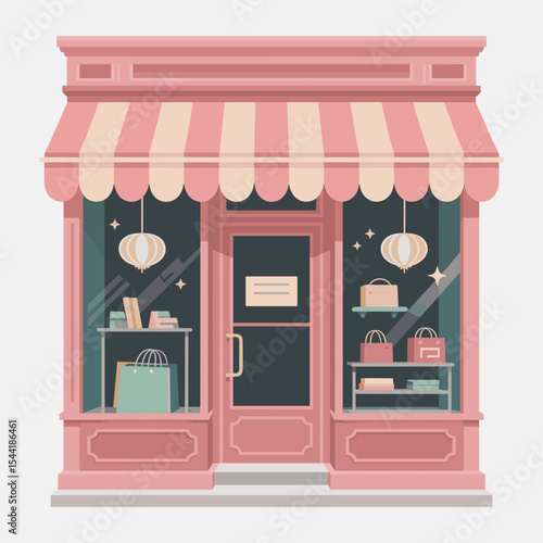 Pink storefront with awning displaying bags and decor items  