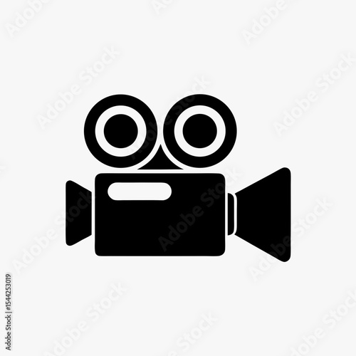 Black silhouette of vintage movie camera icon with dual reels on white background
