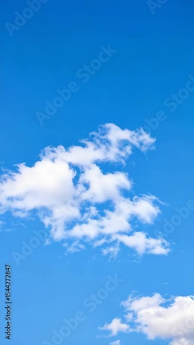 Wallpaper Mural Bright clear blue sky with white fluffy cloudscape featuring cumulus cloud formations, sunny day view with soft clouds against a vivid azure atmosphere Torontodigital.ca