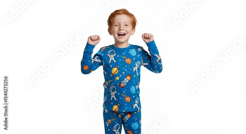 Child in space themed pajamas smiling