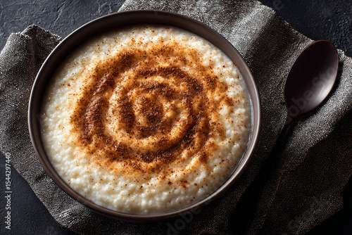 a bowl of rice pudding with cinnamon sprinkles