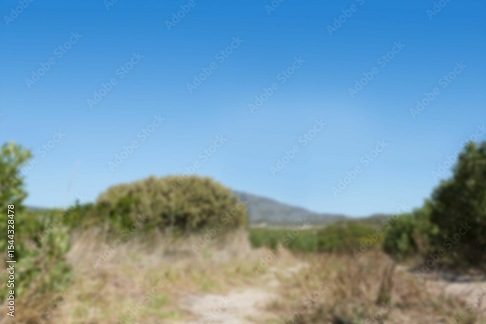 Dirt road by field against clear sky Dirt road by field against clear sky