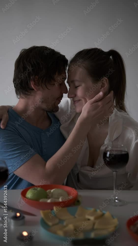 Romantic couple having dinner together at home. Part of series Romantic couple having dinner together at home. Part of series