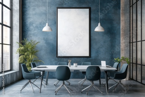 A blue room with a white framed picture on the wall. Blue and gray office meeting room with poster.