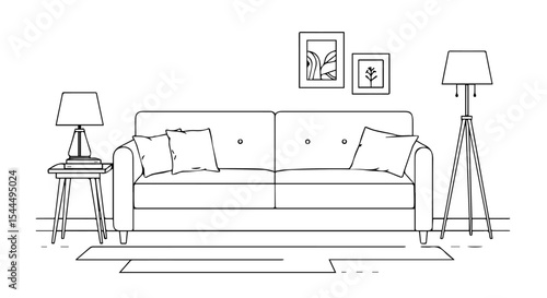 Comfortable sofa with pillows and side table in living room.  Stylish home interior design with floor lamp and framed pictures above sofa.