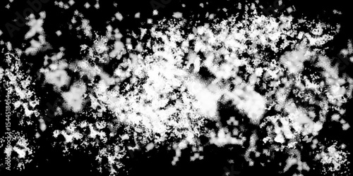 Snowflakes on dark background. white icy snowflakes isolated on black background, natural background. white crystalline powder on a black background. sugar dust. texture, pattern and clipping.
