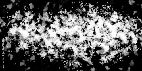 Snowflakes on dark background. white icy snowflakes isolated on black background, natural background. white crystalline powder on a black background. sugar dust. texture, pattern and clipping.