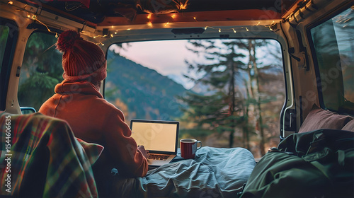Wallpaper Mural Woman working on laptop in cozy camper with open back door, scenic mountains, forest view outside, cup of coffee on the side, warm morning light, boho travel style. Freelancer, remote work Torontodigital.ca