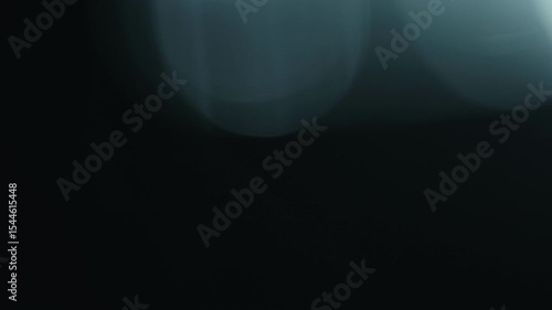 Slow motion real lens flare through glass effects for overlay or transition
