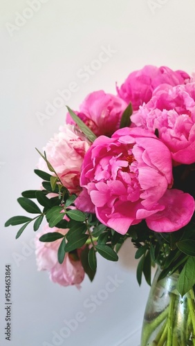 Peony Bouquet isolate. Pink peonies flowers. Large peony flower on a white background. Beautiful pink peony and green. Macro flowers. Bouquet of pink peonies in vase on white background, big peonies 