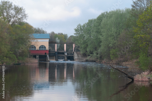 Dam of small hydroelectric power station, water discharge through locks