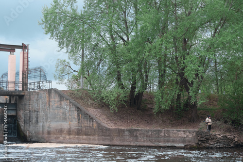 Dam of small hydroelectric power station, water discharge through locks
