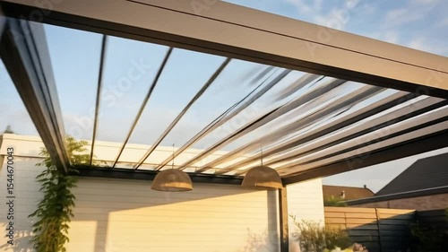 Modern outdoor patio design with retractable pergola and comfortable seating area in daylight